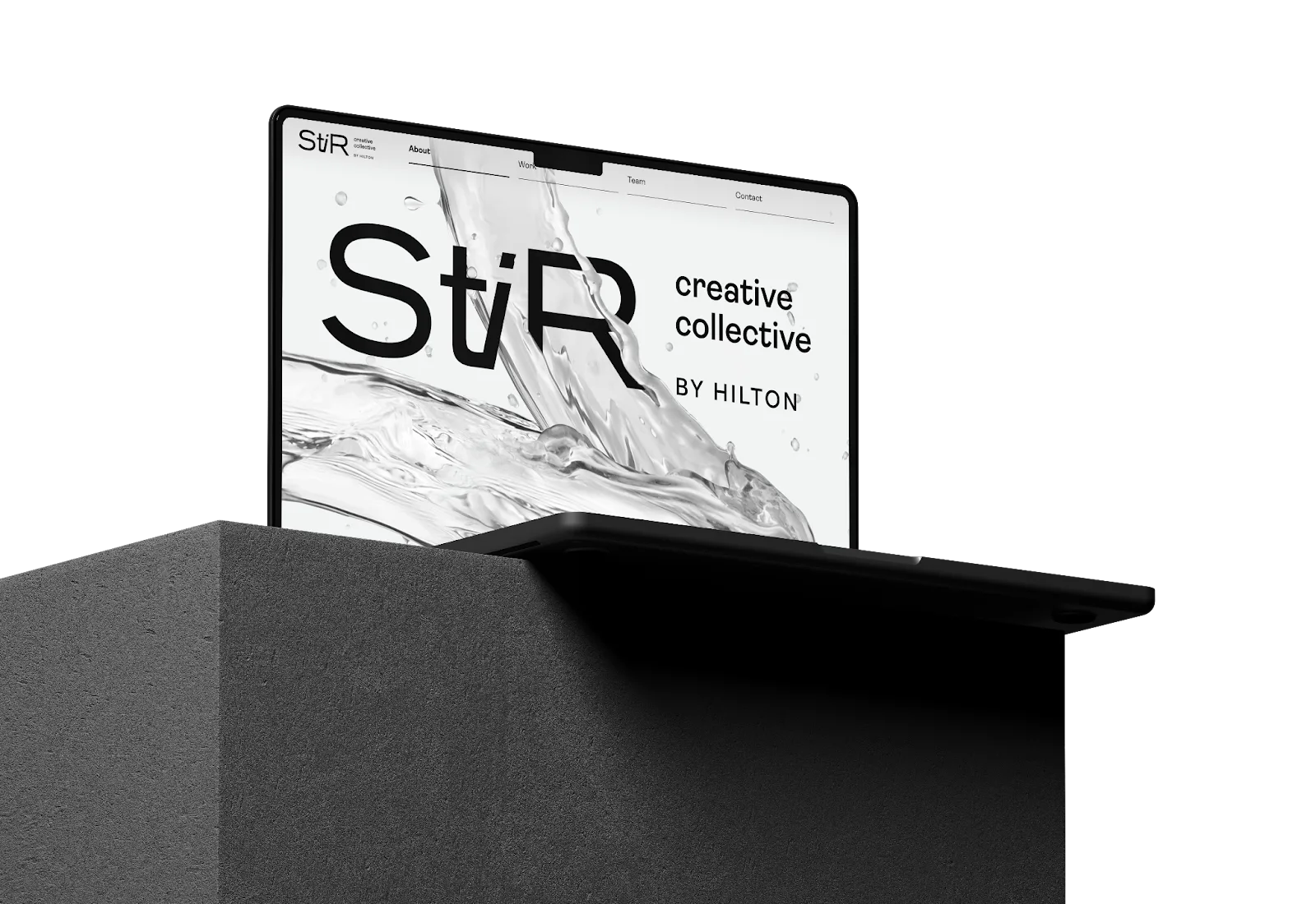 The StiR homepage on a laptop